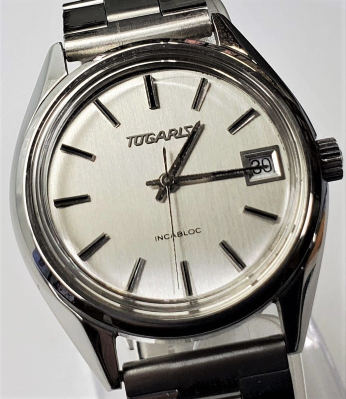 ツガリス（TUGARIS)・スイス製紳士手巻き・カレンダー付き・１９７０ 